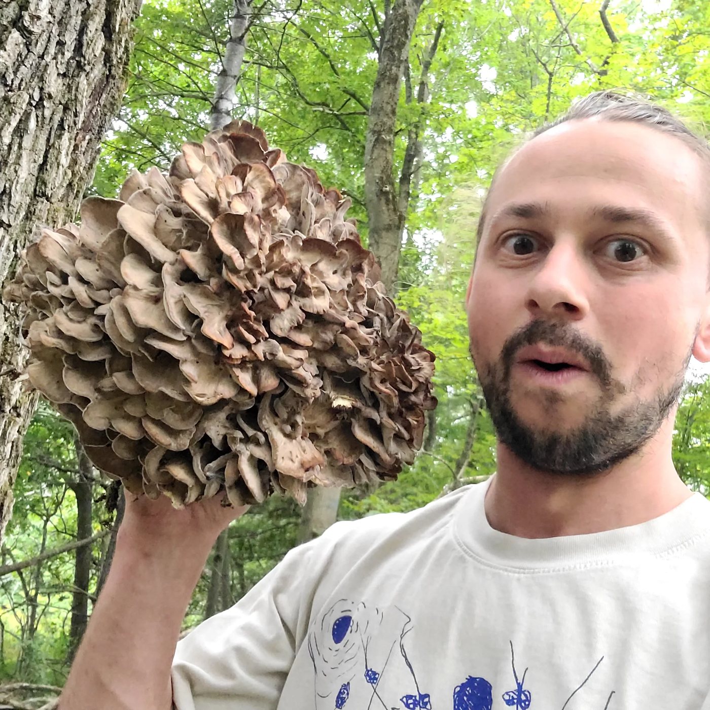 Matthew Getzin holding a large hen-of-the-woods